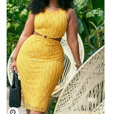 a woman in a yellow dress is standing next to a hammock and holding a handbag