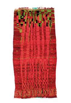 a red and green rug with fringes on it