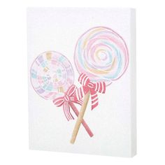 two lollipops on a white background with pink bows