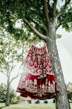 Scarlet - Red Velvet Bridal Lehenga choli w/ Zari Stones and heavy Dabka Work This year celebrate your wedding wearing our royal scarlet bridal lehenga that teleports you to a royal fairytale wedding that could never be imagined. Boat neckline heavy embroidered bridal choli blouse Princess-cut patterning for perfect fitting Rich textured velvet fabric choli Modern yet Classic Boat neck design Intricate zari Stones & Dabka embroidery Back tie-up Dori detailing Comfy elbow-length sleeves Red velve Royal Fairytale Wedding, Bridal Choli, Velvet Bridal Lehenga, Dabka Embroidery, Boat Neck Design, Dabka Work, Embroidery Indian, Lehenga Red, Choli Blouse