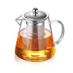 a glass tea pot with a metal strainer in the shape of an upside down teapot