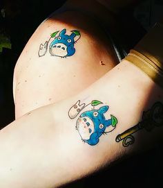 two people with matching tattoos on their arms