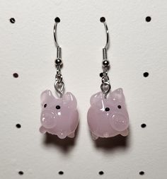 A cute pair of earrings made using pig shaped beads! -Each earring is made using nickel free earring wires that are 100% iron -Each pair comes with 2 silicone earring backs Pink Resin Novelty Earrings, Cute Adjustable Resin Earrings, Novelty Hypoallergenic Resin Earrings, Novelty Dangle Resin Earrings, Novelty Resin Earrings With Ear Wire, Novelty Resin Dangle Earrings, Cute Resin Earrings, Pig Earrings, Earring Wires