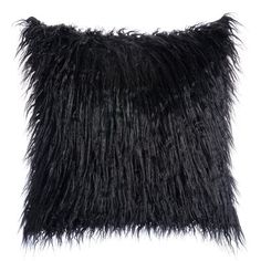 a black pillow with long, shaggy fur on the front and back of it's edges