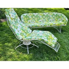 a lawn chair and chaise lounge in the grass