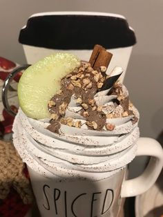 a cup filled with whipped cream and toppings