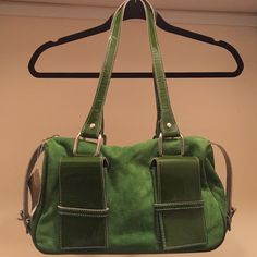 Kelley Green patent and suede purse Beautiful and brand new Kelley green handbag with two exterior pockets and zipper pocket inside. Kiki Pearl Bags Green Rectangular Shoulder Bag With Silver-tone Hardware, Green Bags With Silver-tone Hardware And Double Handle, Green Satchel With Silver-tone Hardware And Double Handle, Green Rectangular Satchel With Silver-tone Hardware, Green Satchel With Silver-tone Hardware For Daily Use, Formal Green Shoulder Bag With Leather Handles, Green Satchel Bag With Silver-tone Hardware, Green Bags With Silver-tone Hardware For Everyday Use, Pearl Bags