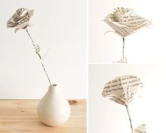 a white vase with a flower made out of old book pages sitting on top of a wooden table