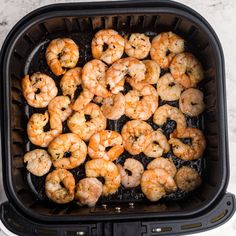 shrimp being cooked in an air fryer