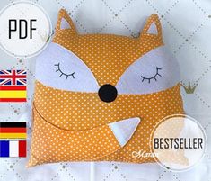 a small pillow with a fox face on it