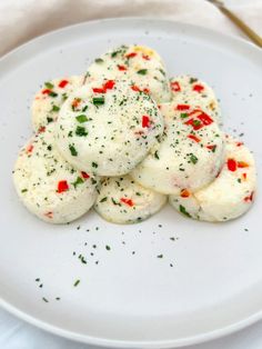 some food is sitting on a white plate