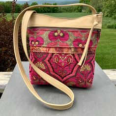 "Amazing Gorgeous Hot Pink Bohemian Tapestry Crossbody Bag. The main body and the strap are beautiful quality Italian Leather. It's a medium large size-my most popular size bag. The Chenille Upholstery Tapestry is made in Turkey. This is a Bag made to be used Everyday. Outside of bag has a zipper pocket on both front and back.11\"top zip opens to the roomy interior with 3 smaller pockets-one of them sized just right for the largest phone. Plus my signature clip-off key ring. 11 1/2\" wide 11\" d Bohemian Tapestry Shoulder Bag For Everyday Use, Everyday Bohemian Tapestry Shoulder Bag, Tapestry Shoulder Bag With Removable Pouch, Embroidered Tapestry Bag For Everyday Use, Tapestry Shoulder Bag With Adjustable Strap, Tapestry Bag For Everyday Use, Daily Use Tapestry Bags With Adjustable Strap, Travel Shoulder Bag With Adjustable Strap In Tapestry, Everyday Tapestry Shoulder Bag With Detachable Strap