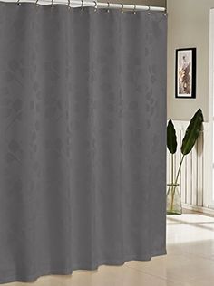 a gray shower curtain in a bathroom