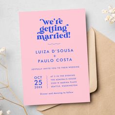 a pink and blue wedding card with the words we're getting married on it