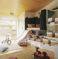 a child's room with toys, bookshelves and other items in it