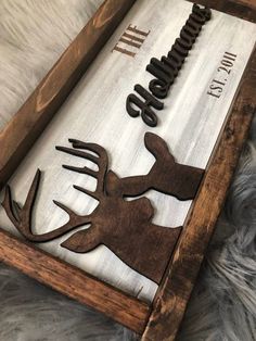 a wooden tray with metal deer silhouettes on it