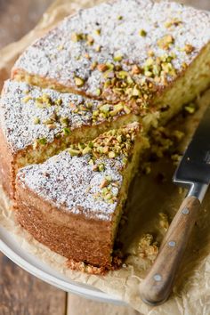 a cake on a plate with a knife next to it