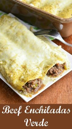 an enchilada sitting on top of a white plate next to a casserole dish