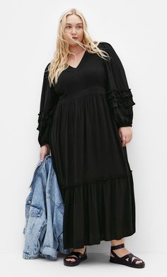 Impress them all with the Malia Plain Maxi Dress. The V neckline adds a classic yet flattering touch to your look. Complete with a relaxed tiered skirt and long sleeves, take your styling to new heights with this dress. Key Features Include: - V neckline - Long sleeves w/elastic cuff - Side invisible zip closure - Functional side pockets - Partially lined - Relaxed tiered skirt - Maxi length Pair with embellished heels for date night. | Plus Size Malia Plain Maxi Dress in Black, Size 16 | City C Date Night Plus Size, Plain Maxi Dress, Dresses Date Night, Embellished Heels, Skirt Maxi, Lingerie Dress, Date Night Dresses, Invisible Zip, Casual Summer Dresses