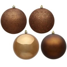 three brown and one gold christmas ornaments are shown in this image with the same color