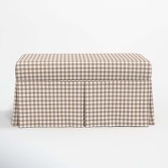 a brown and white checkered bench cover