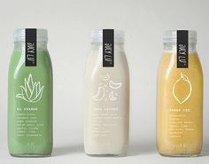 three different types of smoothies in glass bottles