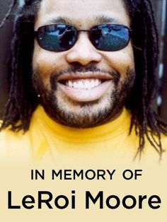 a man with dreadlocks and sunglasses smiling at the camera, in memory of leroy moore