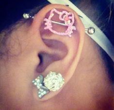 an ear with hello kitty and bowknots on it