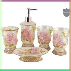 a bathroom set with pink flowers on it