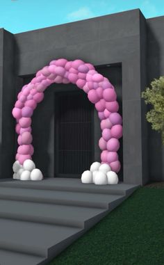 an arch made out of pink and white balloons in front of a building with stairs