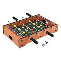 a wooden foosball table with soccer players on it