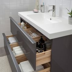 a bathroom sink with drawers underneath it