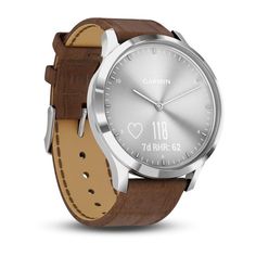 the garmin watch is made from stainless steel and has a brown leather band with silver dial