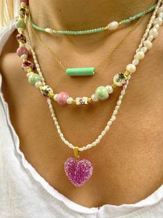 Four different handmade summer necklaces with different beads and charms but similar philosophy. The first necklace has some tiny beads in lyght green color, the second one is a dainty necklace with a light green bar from ceramic that is passsed through a gold chain, the third one is a really special neckalce with colorful ceramic beads and pearls. The last necklace is a pearls beaded necklace Combine them all together or wear them separetely as well. In Christina Christi Jewels store you can se Green Heart-shaped Beaded Necklace Gift, Everyday Green Beaded Chain Necklace, Everyday Green Beaded Necklaces, Green Necklaces With Tiny Beads For Everyday Wear, Bohemian Beaded Necklaces With Pearl Charm As Gift, Handmade Charm Necklaces With Round Beads For Everyday, Bohemian Beaded Necklace With Pearl Charm As Gift, Green Necklaces With Pearl Charm And Round Beads, Everyday Green Necklaces With Tiny Beads