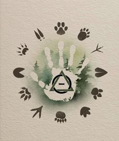 an image of a hand with the letter d in it and paw prints around it