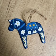 an ornament shaped like a horse with flowers on it