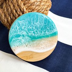 a blue and white plate sitting on top of a table next to a straw hat