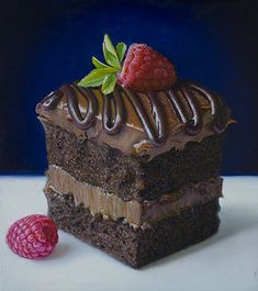 a piece of cake with chocolate frosting and raspberries on top