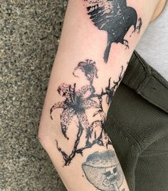 a person with a bird tattoo on their arm