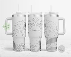 three travel mugs with the same design on them