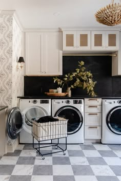 a laundry room with washer and dryer in it