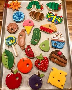 a tray filled with lots of different shaped cookies