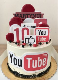 a birthday cake decorated with youtube's logos and magnets for the number ten