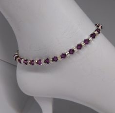 "This durable bracelet or anklet is made on stainless steel accuflex wire and consists of 5mm Swarovski Crystal Amethyst 5mm bicone and silver-plated pewter rondel beads. The lobster claw clasp is made up of steel, pewter, and silver-plated pieces. Sizes - Bracelet: Small 6\" Medium 7\" Large 8\" Sizes-Anklet: Small 9-9 ½\" Medium 10-10 ½\" Large 11-11 ½\" Anklets can also be made for in-between sizes if you let me know the exact length you would like. The best way to find your size is to measur Adjustable Crystal Anklets As Gift, Stainless Steel Wire, Amethyst Crystal, Anklets, Silver Plate, Swarovski Crystals, My Jewellery, Amethyst, Plating