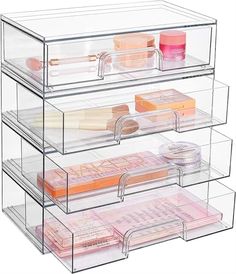 three tiered acrylic makeup storage case with drawers and dividers on each side