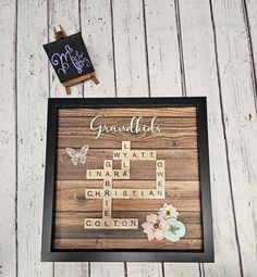 a wooden sign with words written on it next to a chalkboard that says grandma