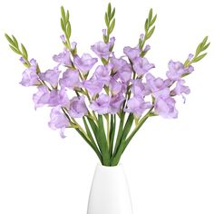 a white vase filled with purple flowers on top of a table