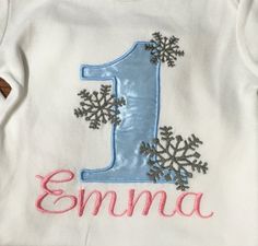 This listing is for a Personalized Winter Wonderland Birthday Shirt. This is a machine embroidered applique design stitched onto the shirt. This shirt can be made in any size! Please contact me for any other info regarding sizing. **please include the information below for personalization in the notes to seller section at checkout. 1. Name 2. Number 3. Size 4. Short or Long Sleeves ** All Items are handmade, please keep in mind that no two items are identical. **There may at times be a slight di Winter Themed Birthday, Winter Wonderland Birthday, Frozen Inspired, Winter Themed, Embroidered Applique, Number 3, Winter Theme, Birthday Shirt, Applique Designs