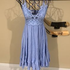 Light Blue Summer Dress. Can Be Worn Casual Or Somewhat Dressy. Perfect For Summer Day Or Night. Purchased At A Boutique In New Smyrna Did Not Fit. This Style Is Similar To The Free People Spaghetti Strap Dress Blue Knee-length Midi Dress With Lace Trim, Light Blue Flowy Mini Dress For Date Night, Flowy Light Blue Mini Dress For Date Night, Light Blue Mini Dress With Lace Trim, Light Blue Sleeveless Mini Dress With Lace Trim, Light Blue Mini Sundress For Party, Blue Bohemian Mini Dress With Lace Trim, Bohemian Blue Mini Dress With Lace Trim, Blue Spaghetti Strap Dress With Lace Trim