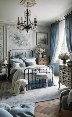 a bed room with a neatly made bed and a chandelier